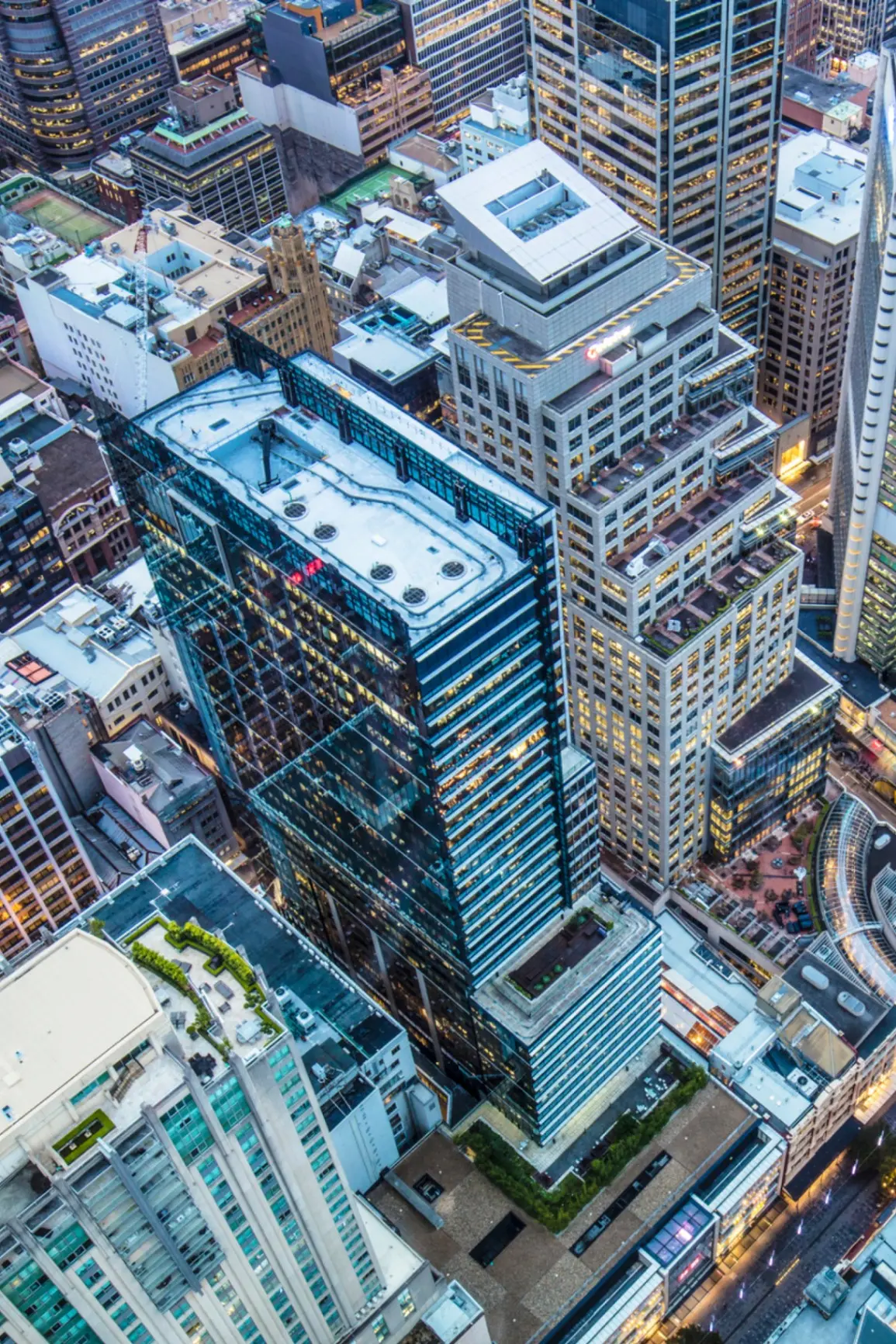 A financial district skyline at dusk, standing in for the institutional infrastructure a Reserve balance sits behind